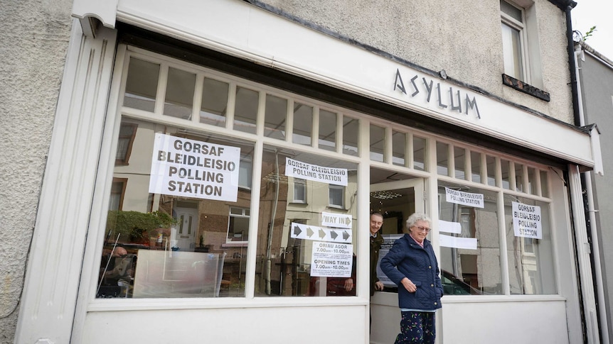 Two leaders leave a hairdressers in Wales after casting their vote in the General Election.
