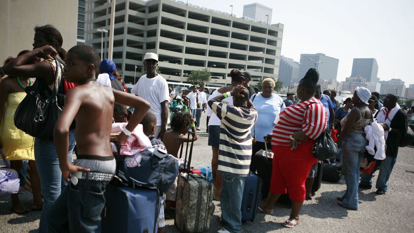 'Everybody must go': New Orleans residents line up for buses and trains to flee Gustav.