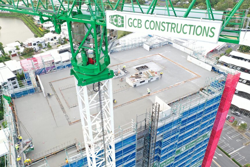 Crane hovers over a construction site
