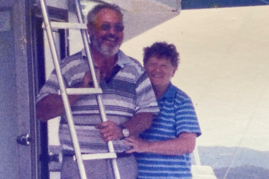 Alwyn and Jenny Rogash in an old picture smiling together beside a ladder.