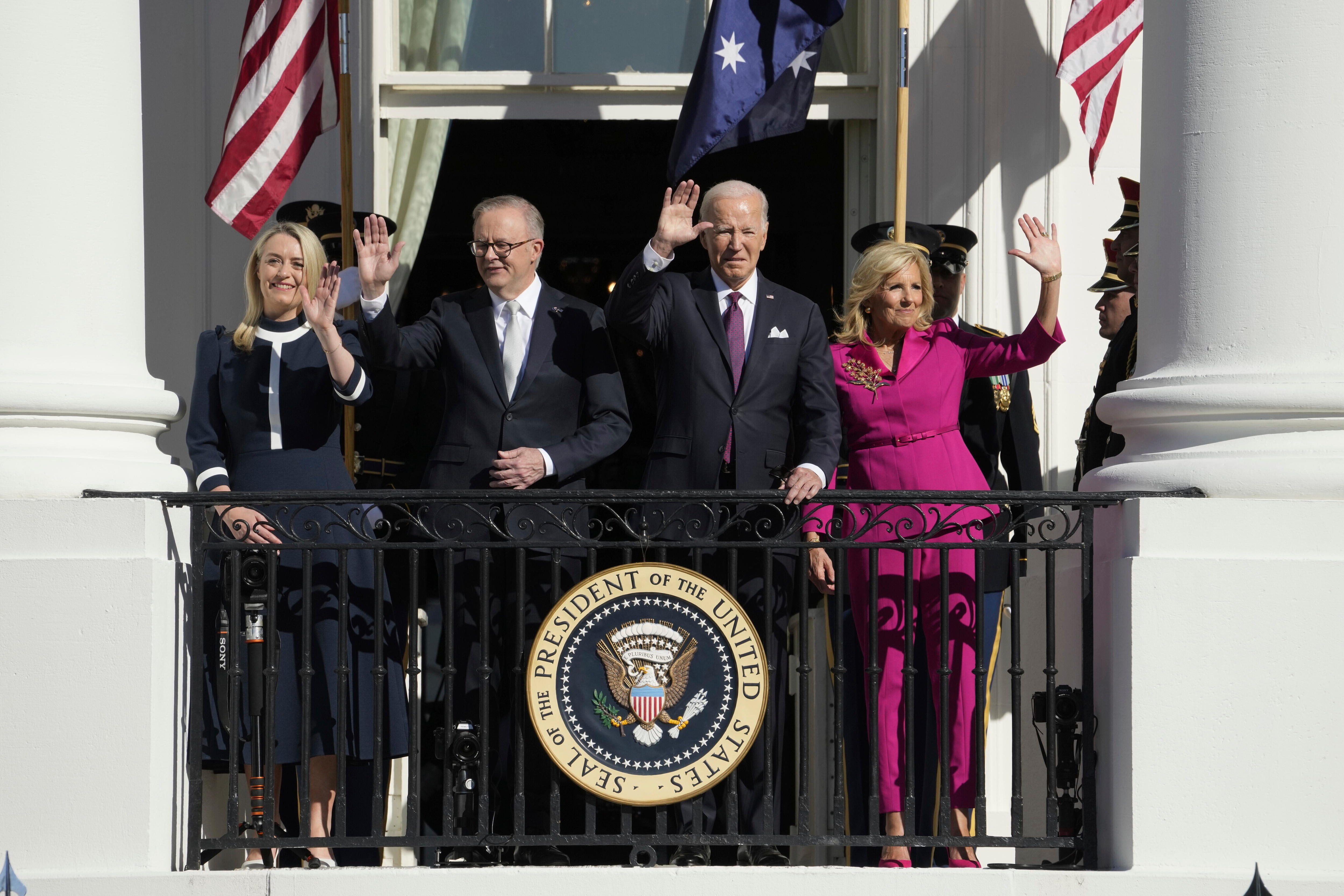 Jodie Haydon, Anthony Albanese, Joe Biden and Jill Biden wave from the White House balcony.