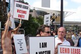 A group of small business owners protest outside the Lend Lease AGM