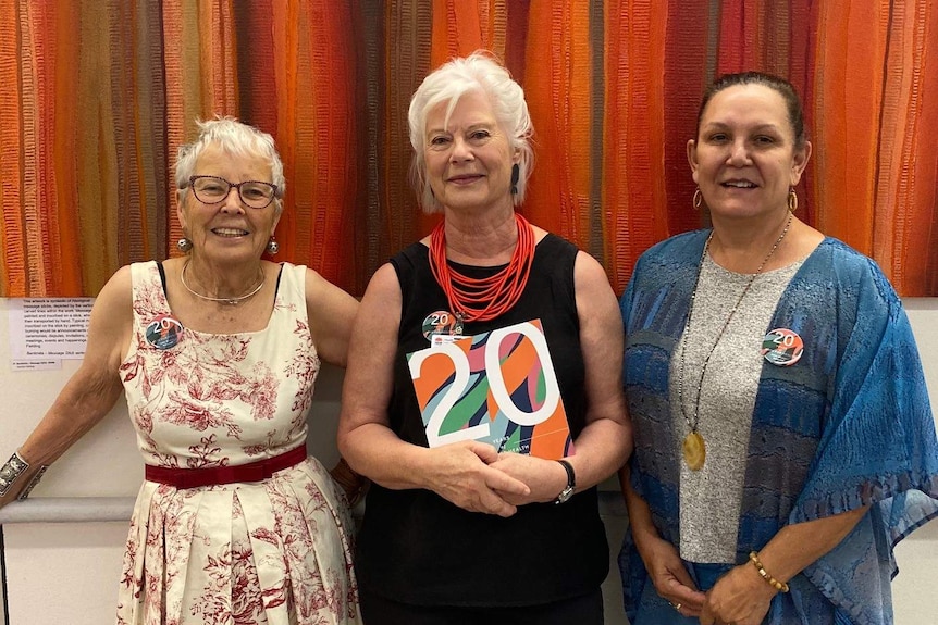 Three women at a book launch for a history event