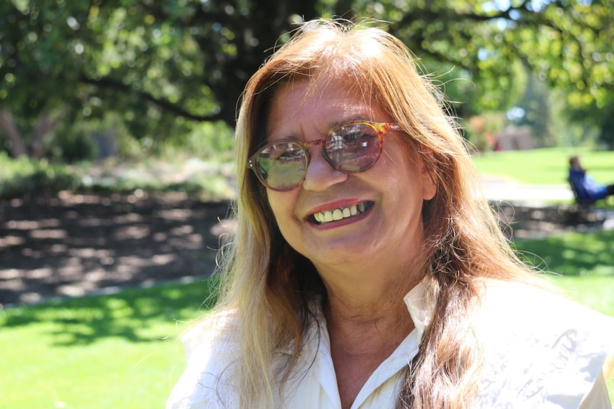 Close-up shot of Professor Pat Dudgeon in parkland setting.