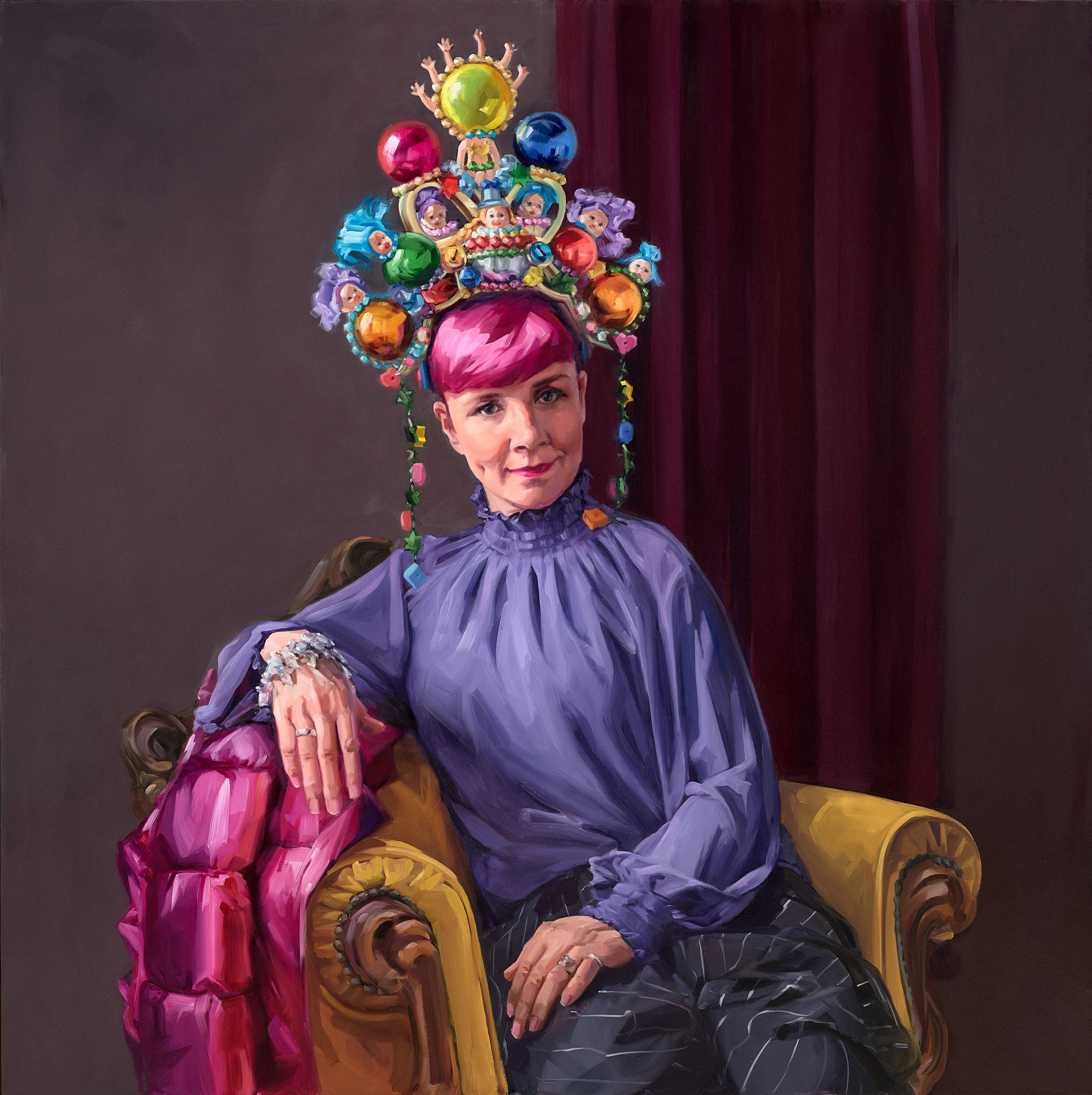Vibrantly coloured portrait of Cal Wilson, a white woman with pink hair wearing a purple top and elaborate headdress.