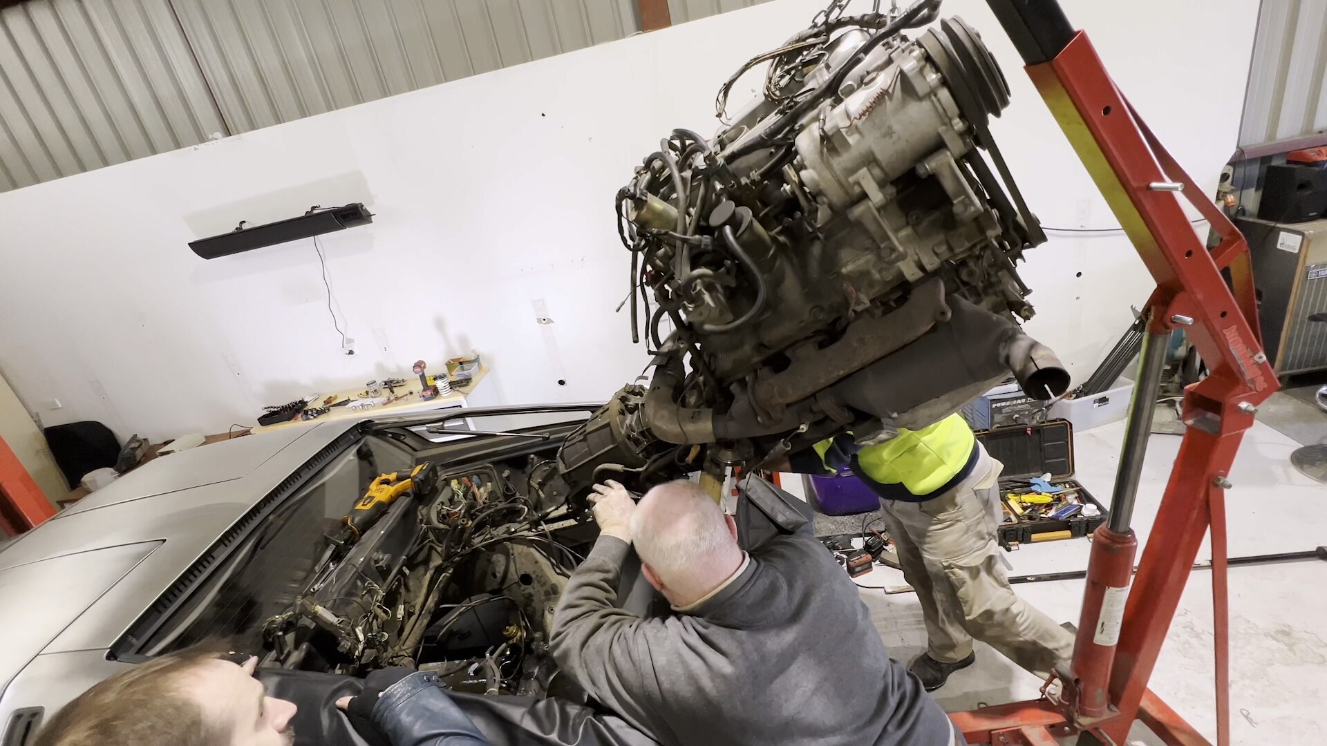 Engine being removed from DeLorean