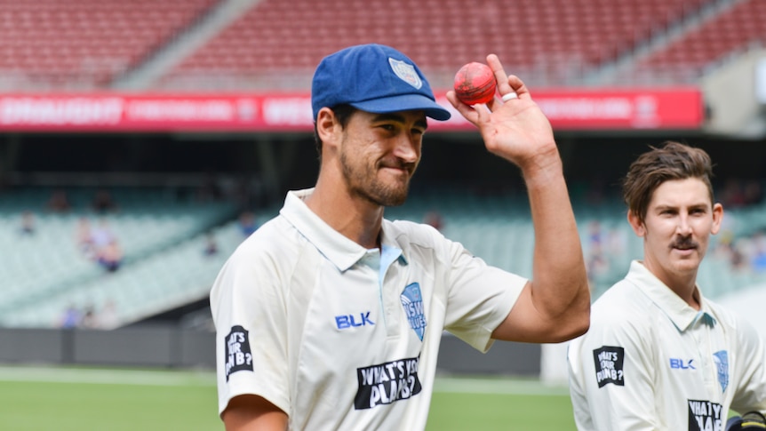 Mitchell Starc salutes the crowd for NSW