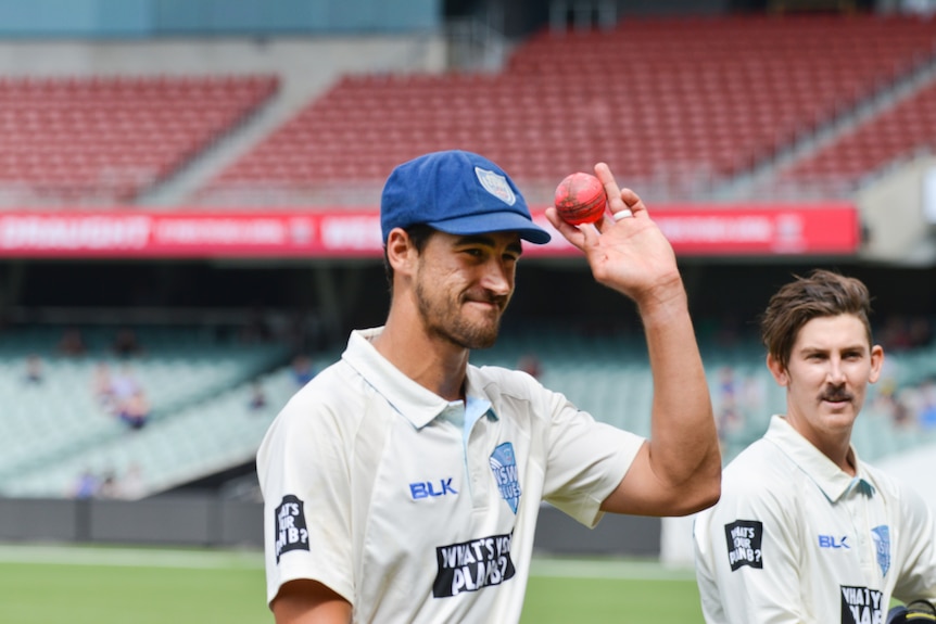 Mitchell Starc salutes the crowd for NSW