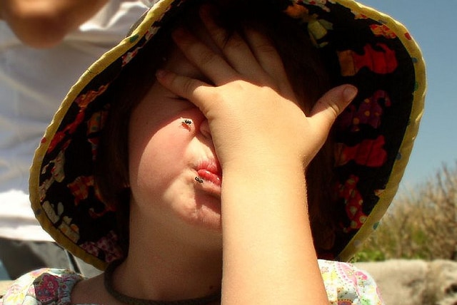 Flies on child's face