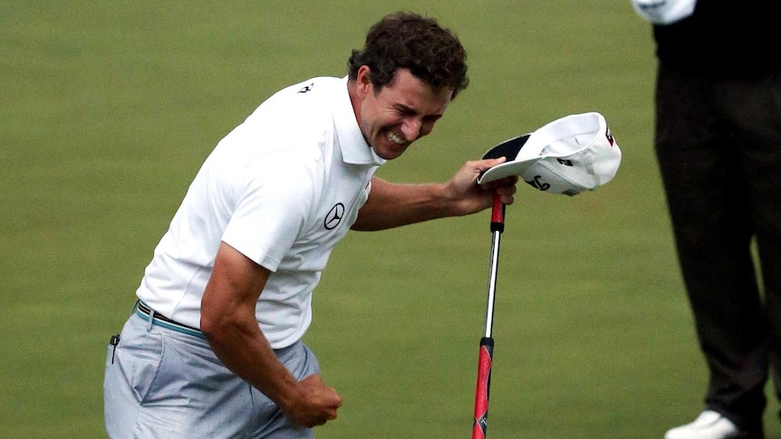 Adam Scott punches the air after winning the Masters.