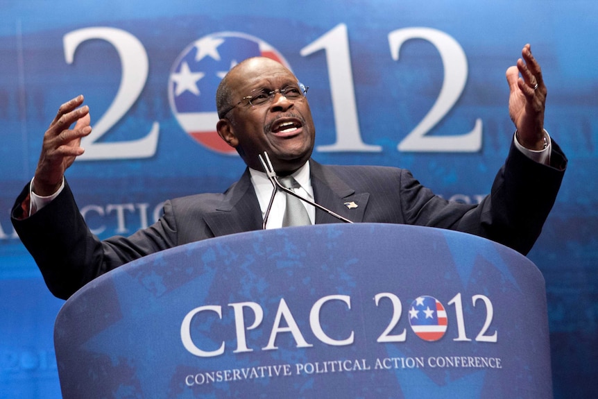 Herman Cain speaking during  a conference.