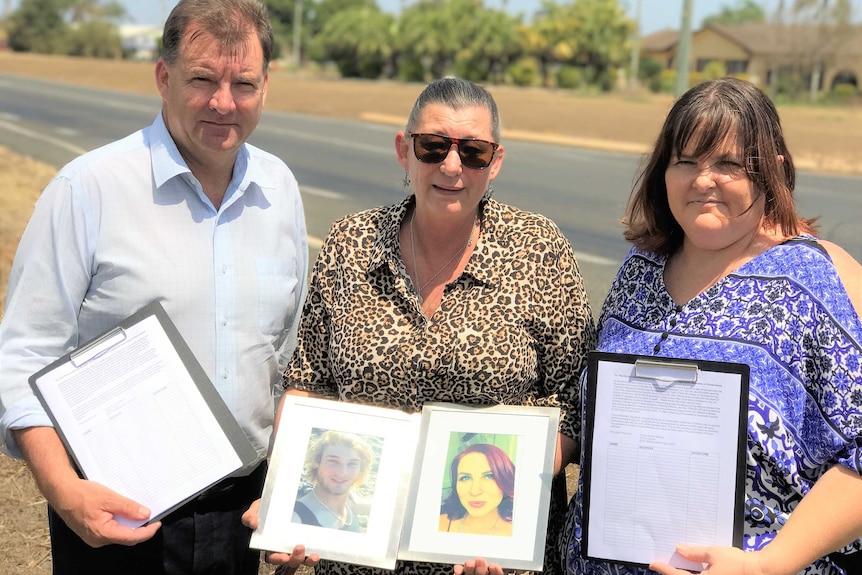 Stephen Bennett, Kerri Walker and Trisha Mabley holding photos of Daniel and Sarah and copies of the petition.