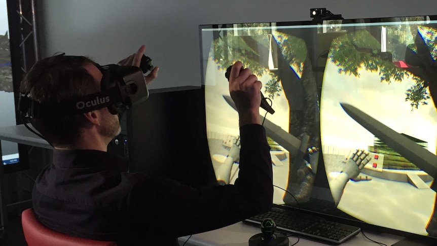 A man experiments with the Oculus Rift headset.