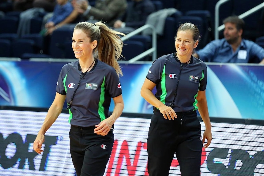 Toni Caldwell smiling on court as she referees at the women's world basketball championships