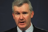 Tony Burke speaking to the media during a press conference.
