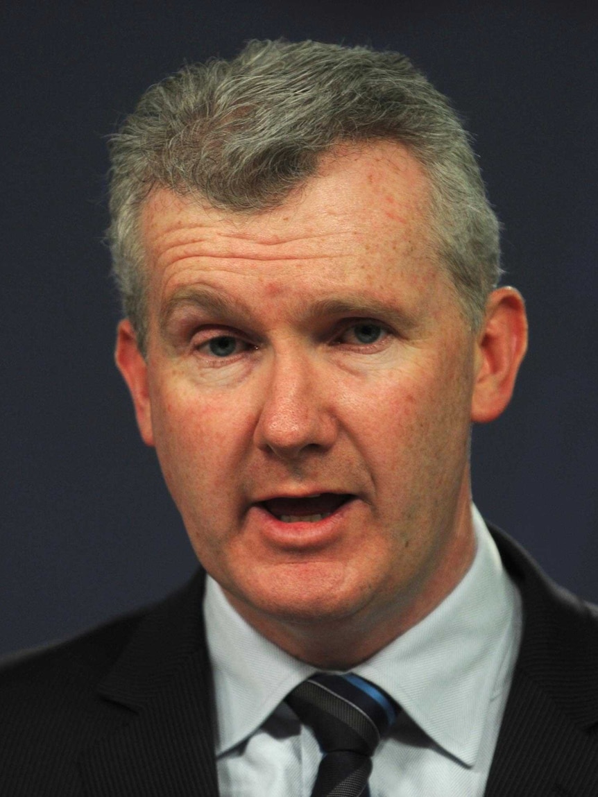 Tony Burke speaking to the media during a press conference.