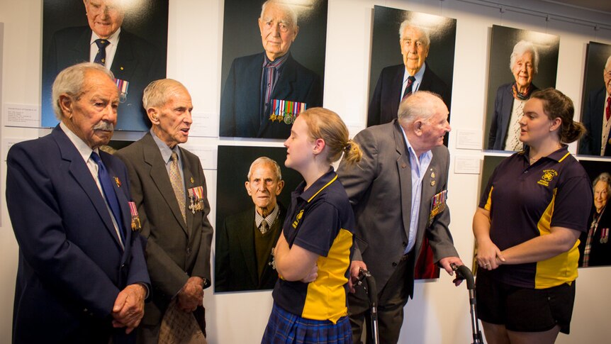 WWII veterans Doug Pedler, Howard Hendrick and Harry Lock talk with Renmark High School students Brianna and Samantha.