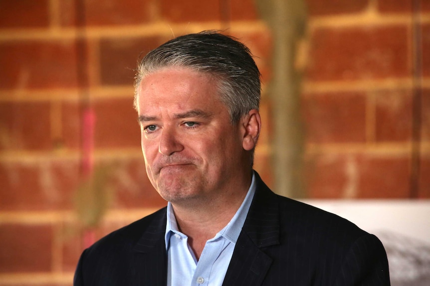 WA Senator and Federal Finance Minister Mathias Cormann at a building site in Piara Waters, Perth WA