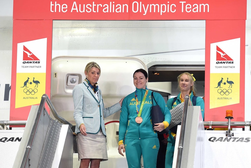 Australian Olympians Anna Meares (C), Kim Brennan (R) and team boss Kitty Chiller return from Rio.