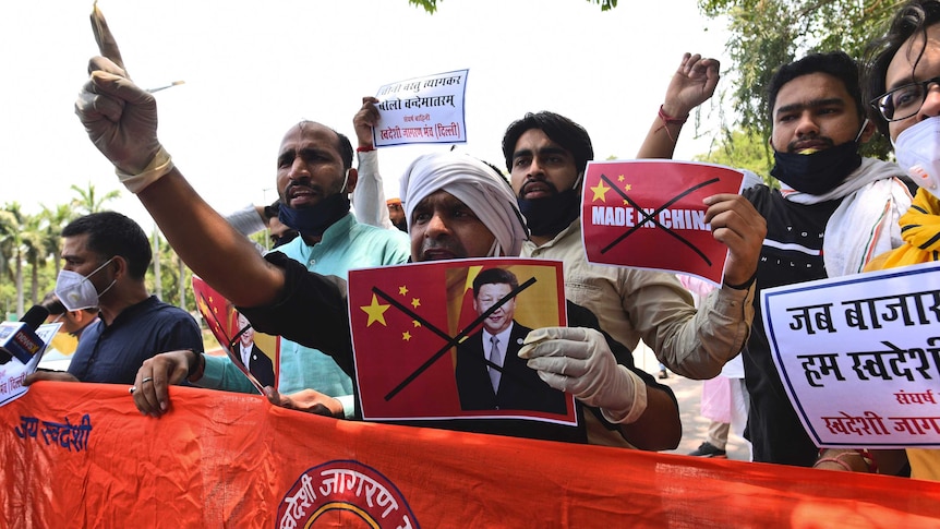 Activists shout slogans and holds anti-China signs during a protest near the Chinese embassy in New Delhi.