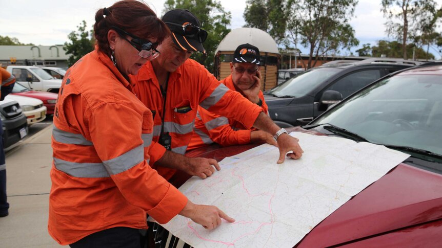 Firefighters plan for road closures Friday morning at the Pinjarra evacuation centre.