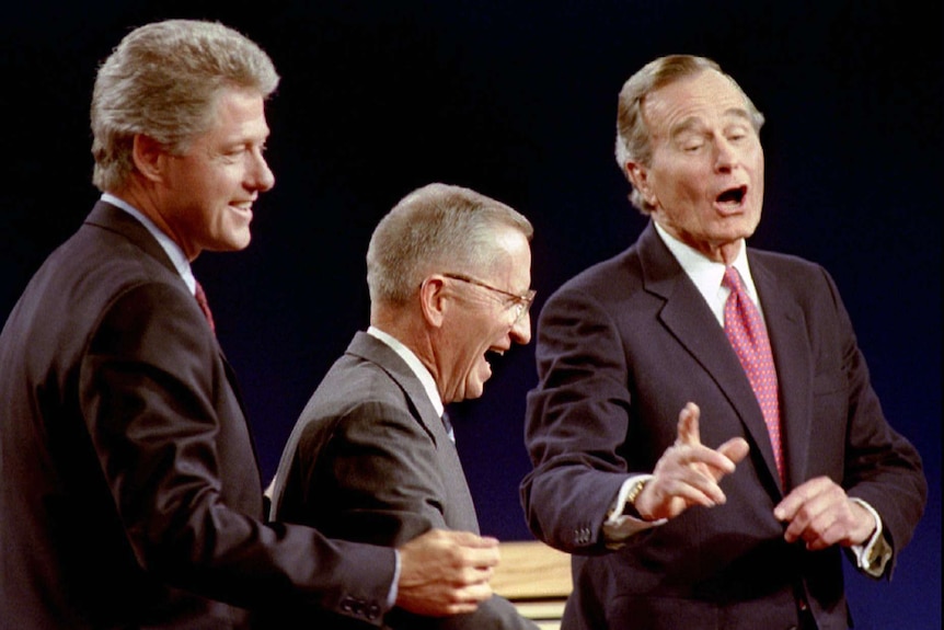 Democratic Presidential candidate Governor Bill Clinton (L) Ross Perot (c) and President George Bush laugh