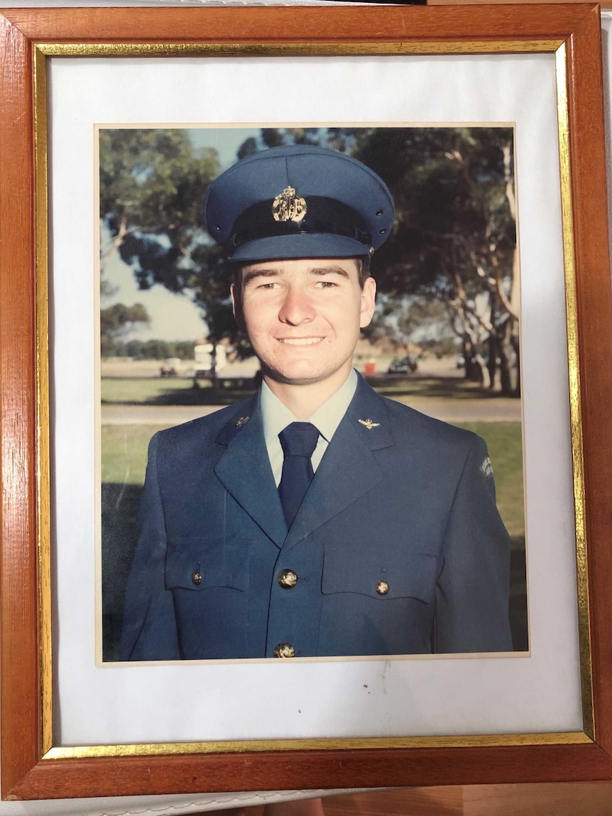 A framed photograph of a young Brian Hunt in his RAAF uniform