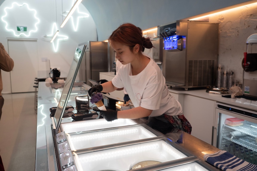 Girl scooping ice cream 