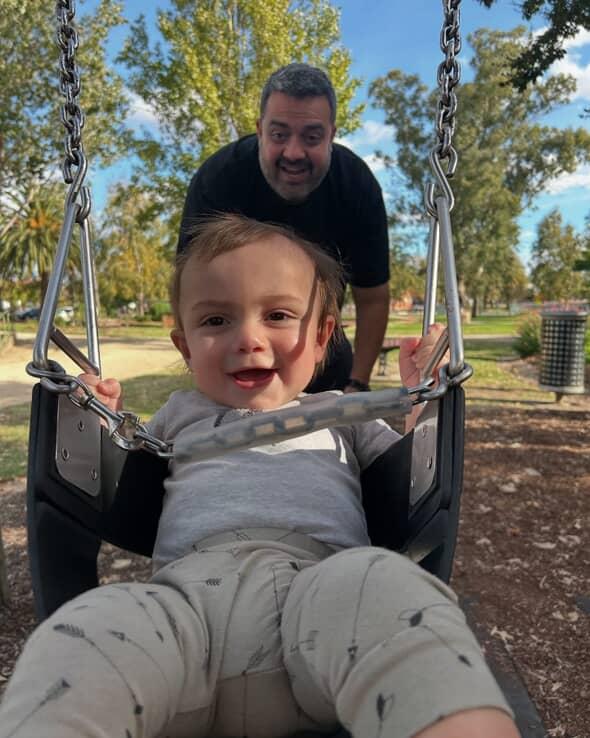  Dane with son Ari on the swing