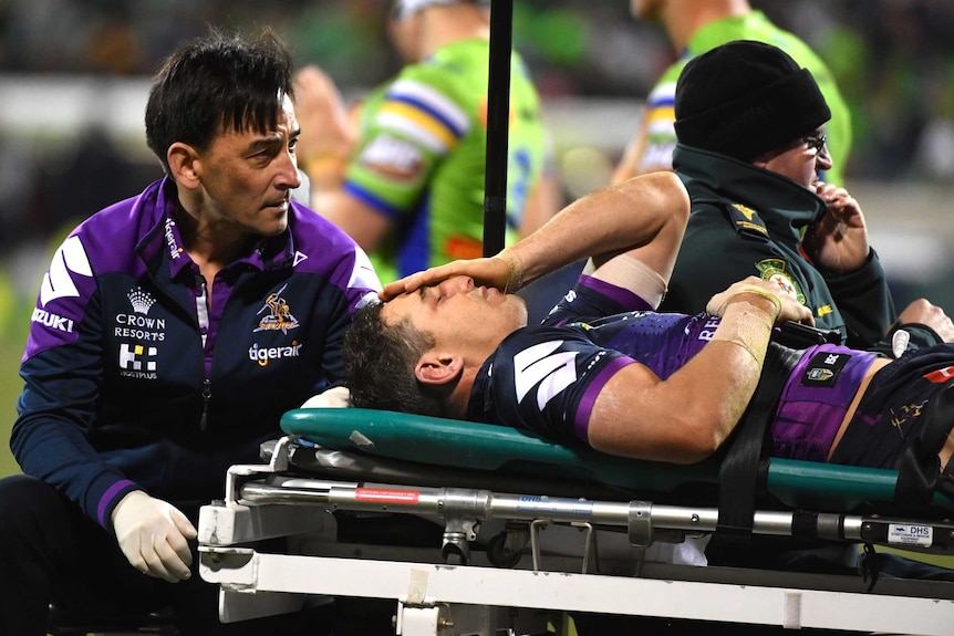 Billy Slater leaves Canberra Stadium on a medicab