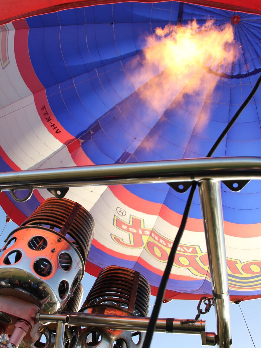 A hot air balloon is inflated in northern Tasmania