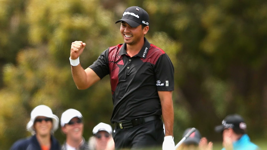 Jason Day celebrates an eagle at Royal Melbourne