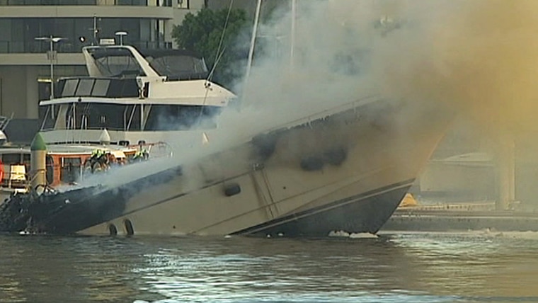 Luxury yacht sinks at Docklands after a huge inferno.