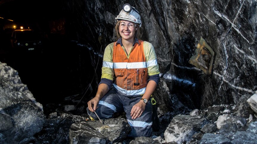 A female geologist in an underground gold mine.