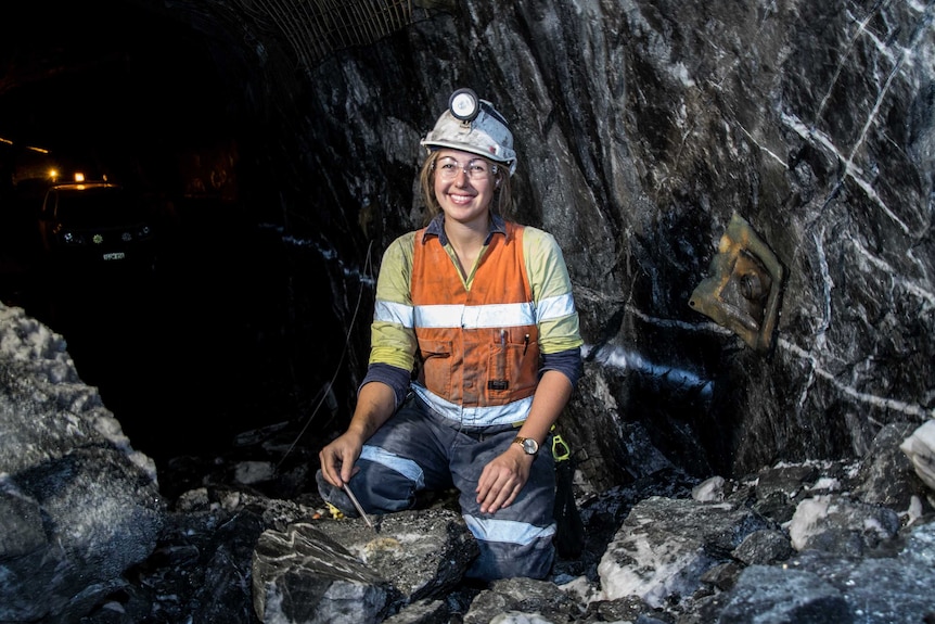A female geologist in an underground gold mine.
