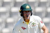 Marnus Labuschagne grimaces as he fends the ball away with the bat