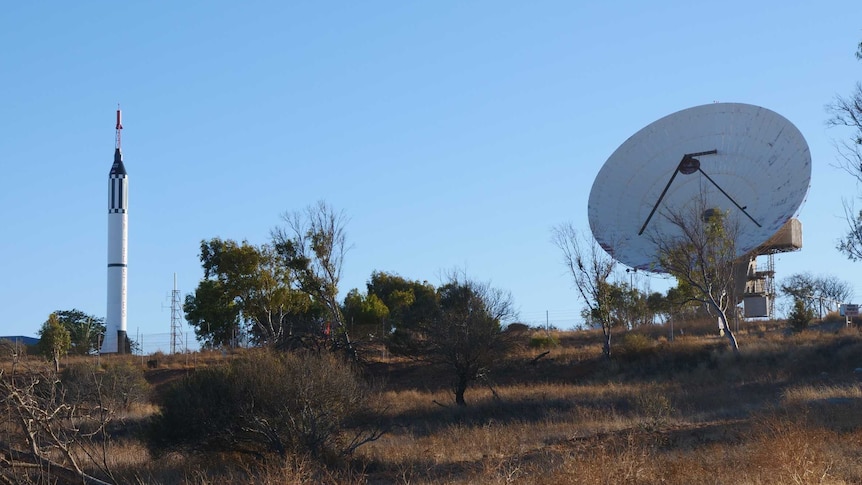 Landscape shot of a hill in Carnarvon with the rocket and OTC dish in the background