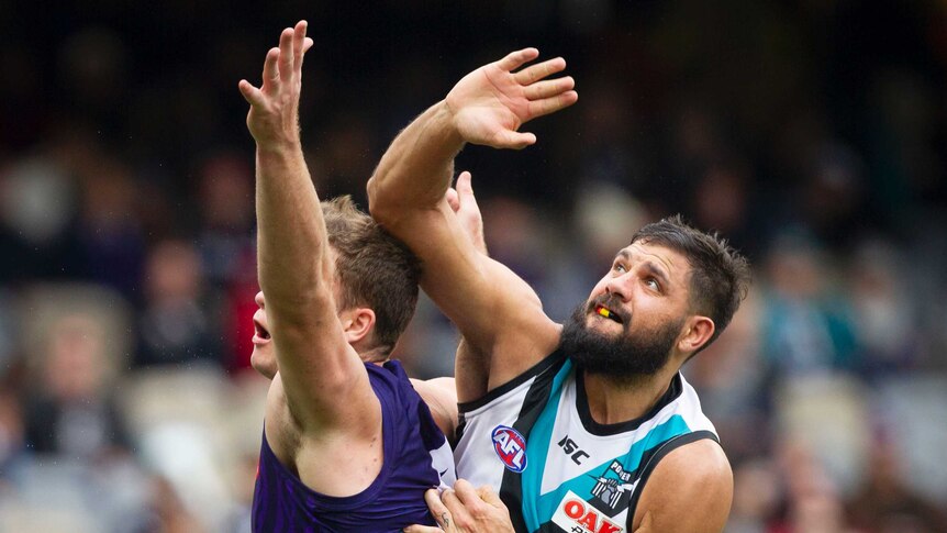 Paddy Ryder contests the ball for Port Adelaide against Fremantle.