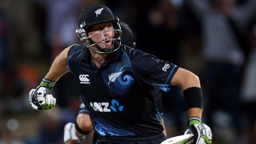 Injured hero ... New Zealand's Martin Guptill celebrates scoring the winning runs.