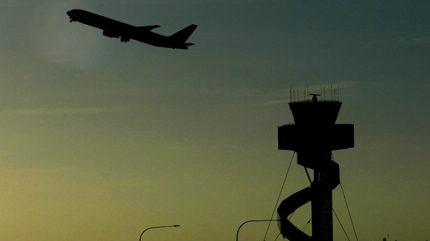 Passenger plane and air traffic control tower at Sydney airport - good generic