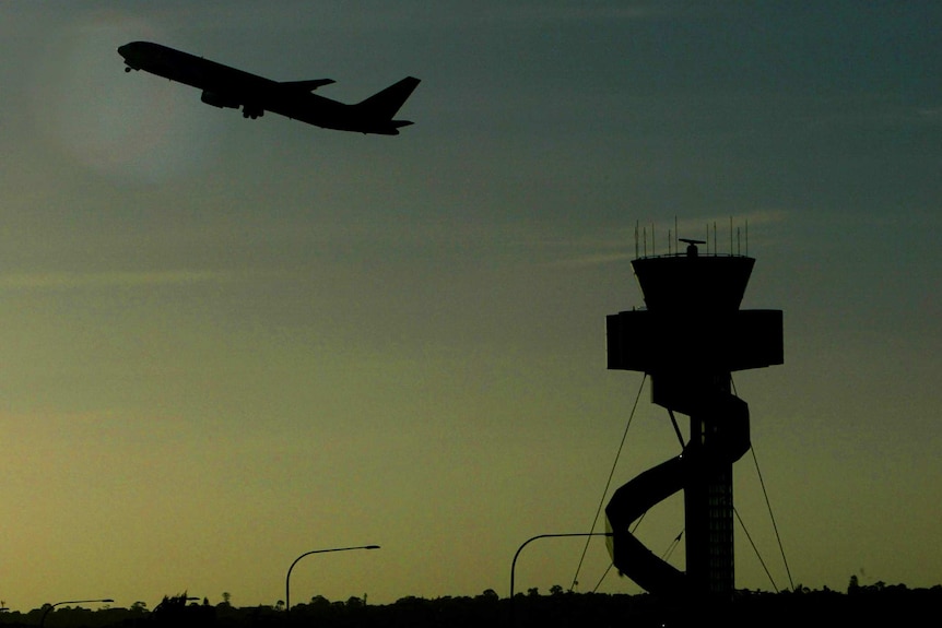 Passenger plane and air traffic control tower at Sydney airport - good generic