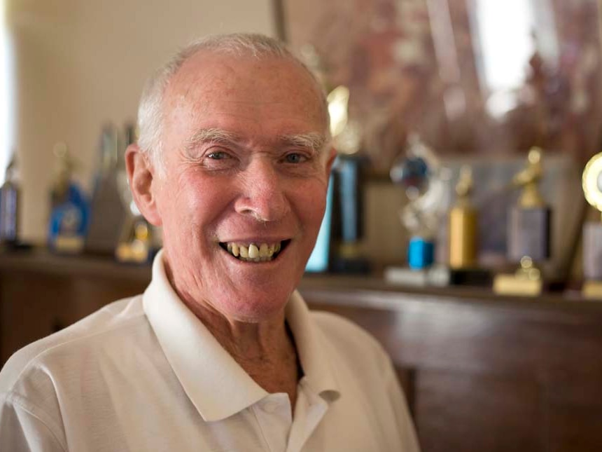 Ken Tucker head shot with cycling trophies in background