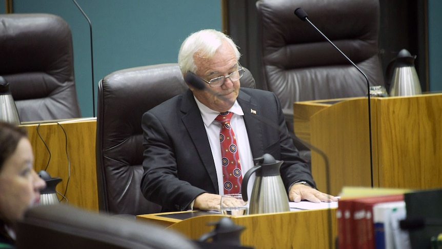 Gary Higgins sits in parliament