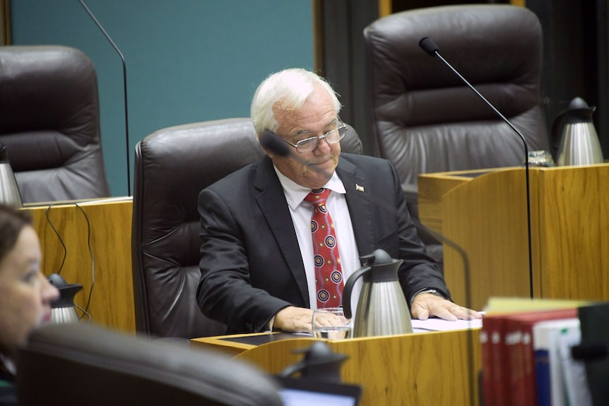 Gary Higgins sits in parliament