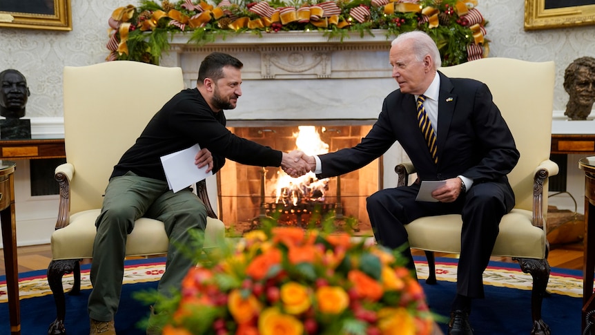 US President Joe Biden shakes hands with Ukrainian President Volodymyr Zelenskyy