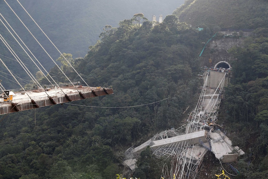 View of a bridge under construction that collapsed over a lush valley in Colombia