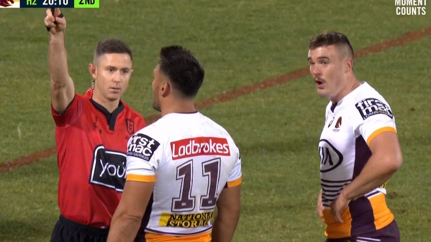 Kobe Hetherington looks astonished as Brisbane Broncos captain Alex Glenn speaks to referee Chris Sutton during an NRL game.