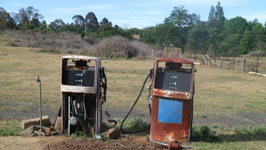 Two burnt out petrol bowsers in regional Australia.