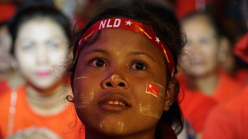 A girl shows her support for the NLD