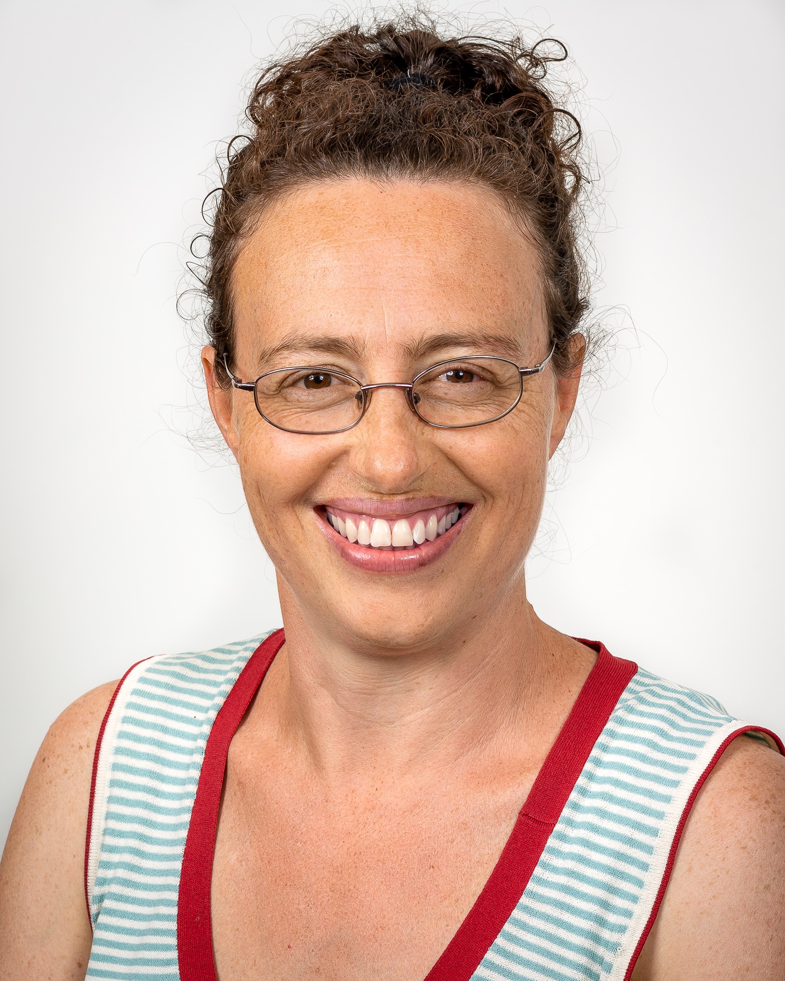 A smiling woman wearing glasses